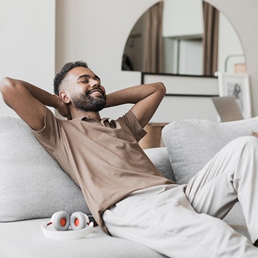 Man smiling while relaxing at home